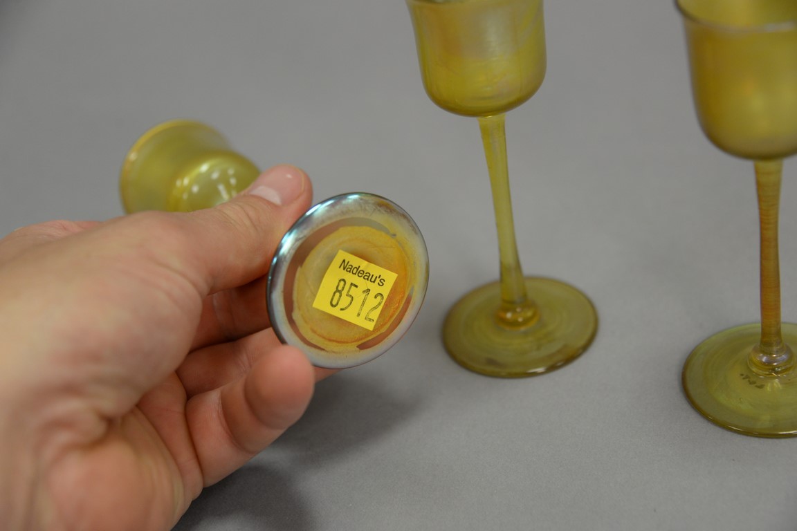 Lot 311 Set of three Tiffany Favrile iridescent glass intaglio cordial
