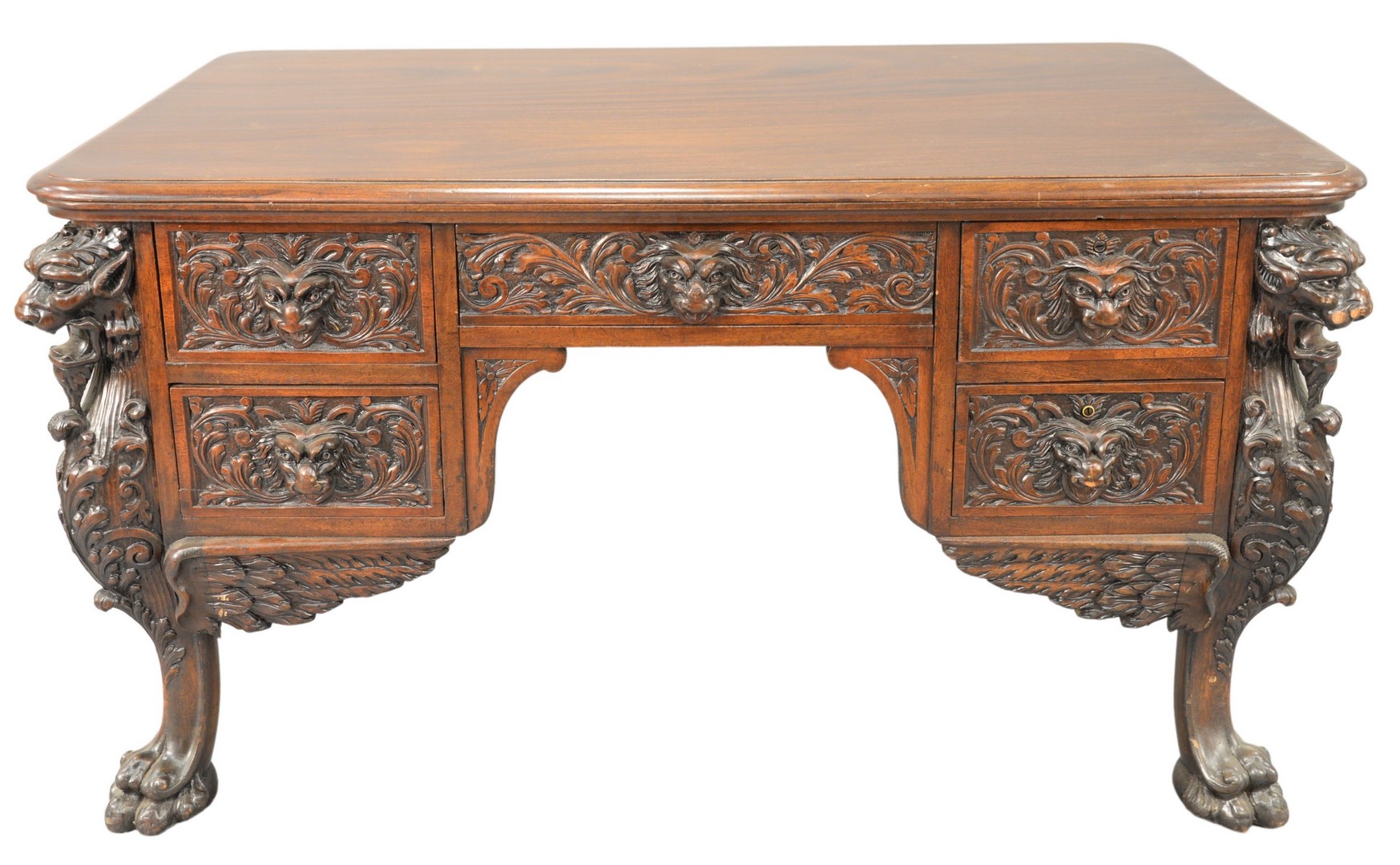 R.J. Horner Mahogany Winged Griffin Carved Desk, having lion face