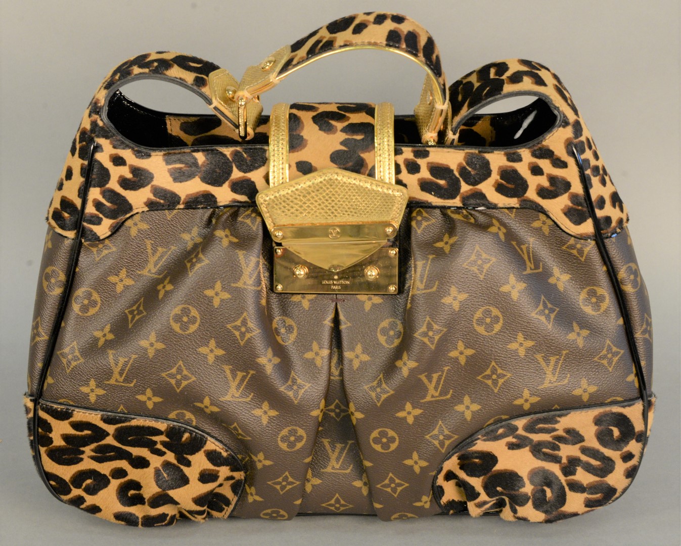 Lot 52: Louis Vuitton leopard print monogram handbag, 'Polly Leo
